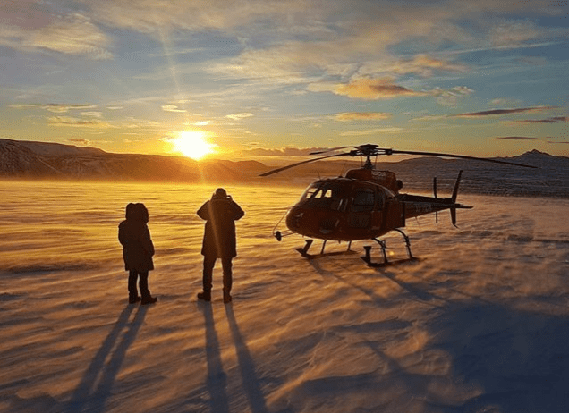 Helicopter landing on a glacier
